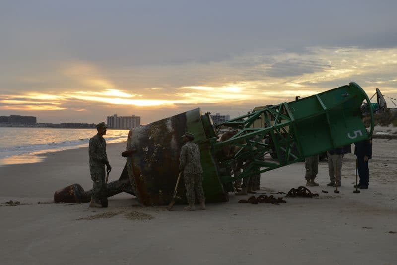 Coast Guard, Navy removes buoy from beach